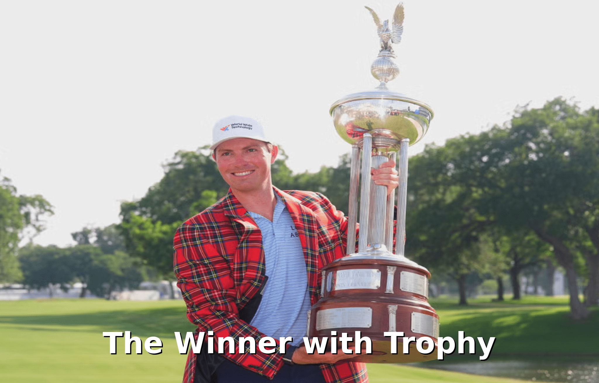 Ben Griffin holds the Charles Schwab Challenge trophy after his final round victory.