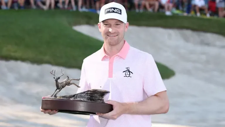 Brian Campbell holding the John Deere Classic trophy after winning the final round in a playoff