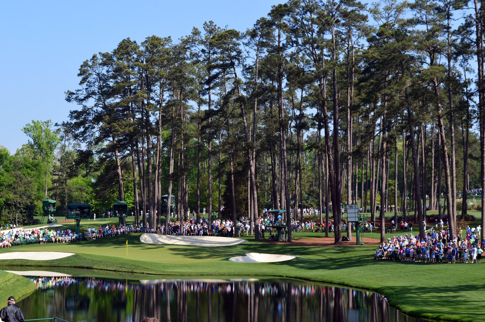 The 16th hole, Redbud, at Augusta National during the 2015 Masters, with crowds around the green